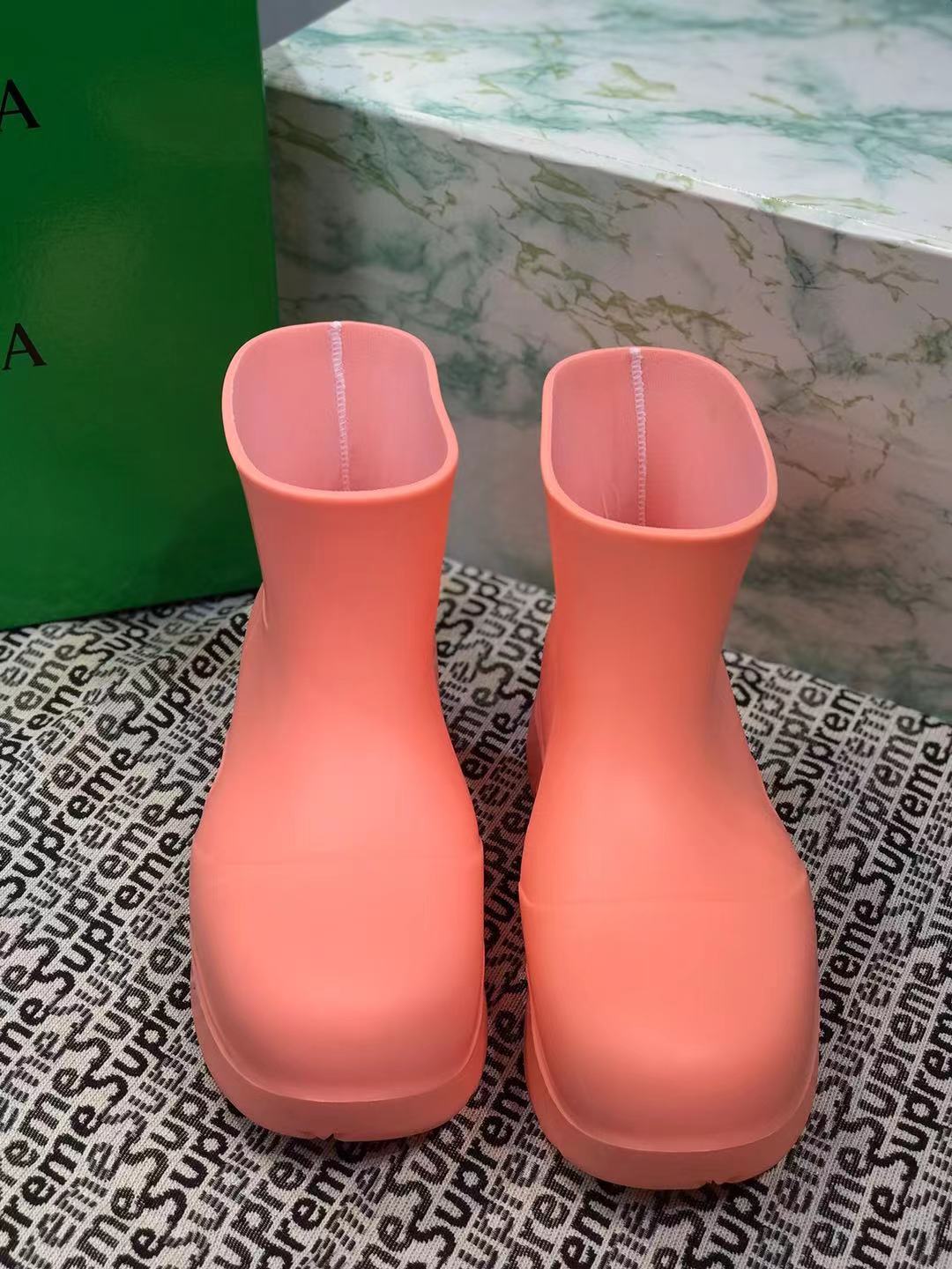 BOTTEGA VENETA PUDDLE ANKLE BOOT IN PUNCH PINK RUBBER