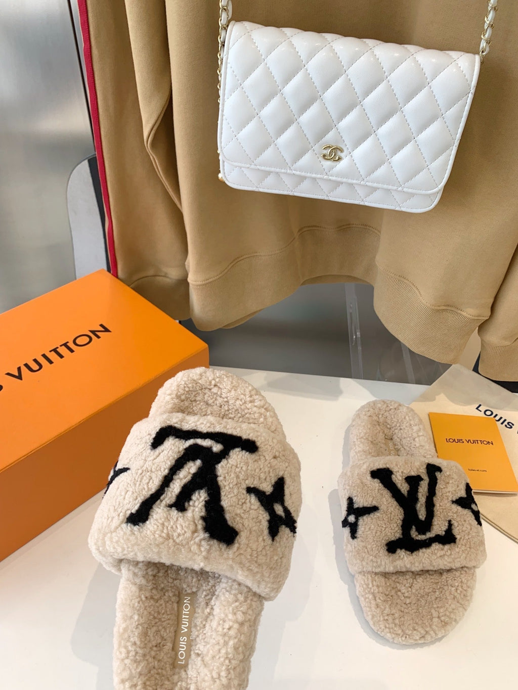 LOUIS VUITTON LV WOMEN'S PASEO FLAT SLIPPER IN TAN BROWN FLEECE WITH BLACK LOGO