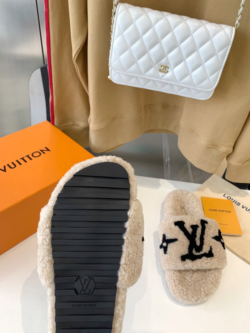 LOUIS VUITTON LV WOMEN'S PASEO FLAT SLIPPER IN TAN BROWN FLEECE WITH BLACK LOGO