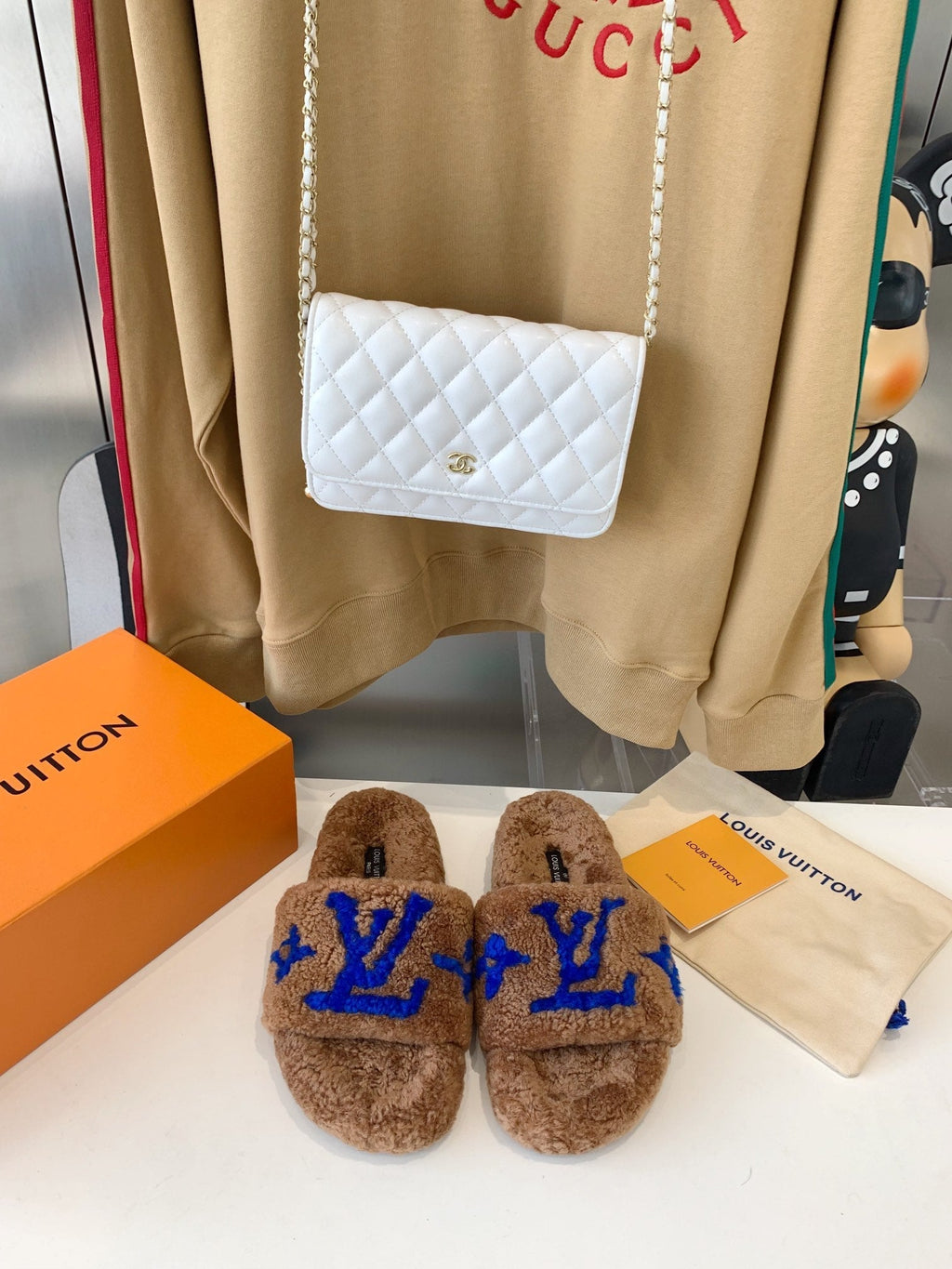 LOUIS VUITTON LV WOMEN'S PASEO FLAT SLIPPER IN BROWN FLEECE WITH BLUE LOGO