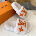LOUIS VUITTON LV WOMEN'S PASEO FLAT SLIPPER IN WHITE FLEECE WITH ORANGE LOGO