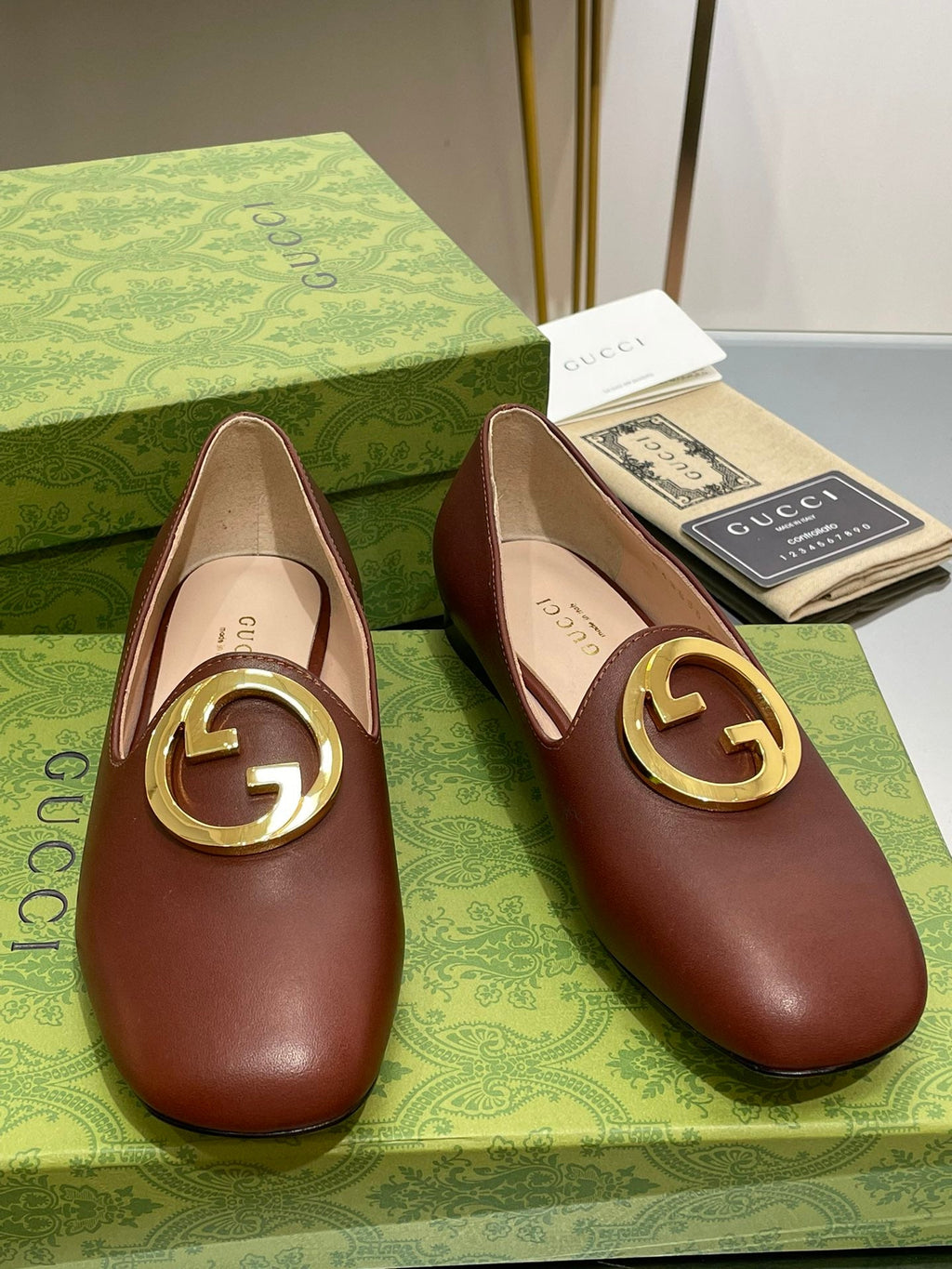 GUCCI BLONDIE LOGO-PLAQUE LOAFERS IN SYRUP BROWN CALFSKIN WITH GOLD HARDWARE