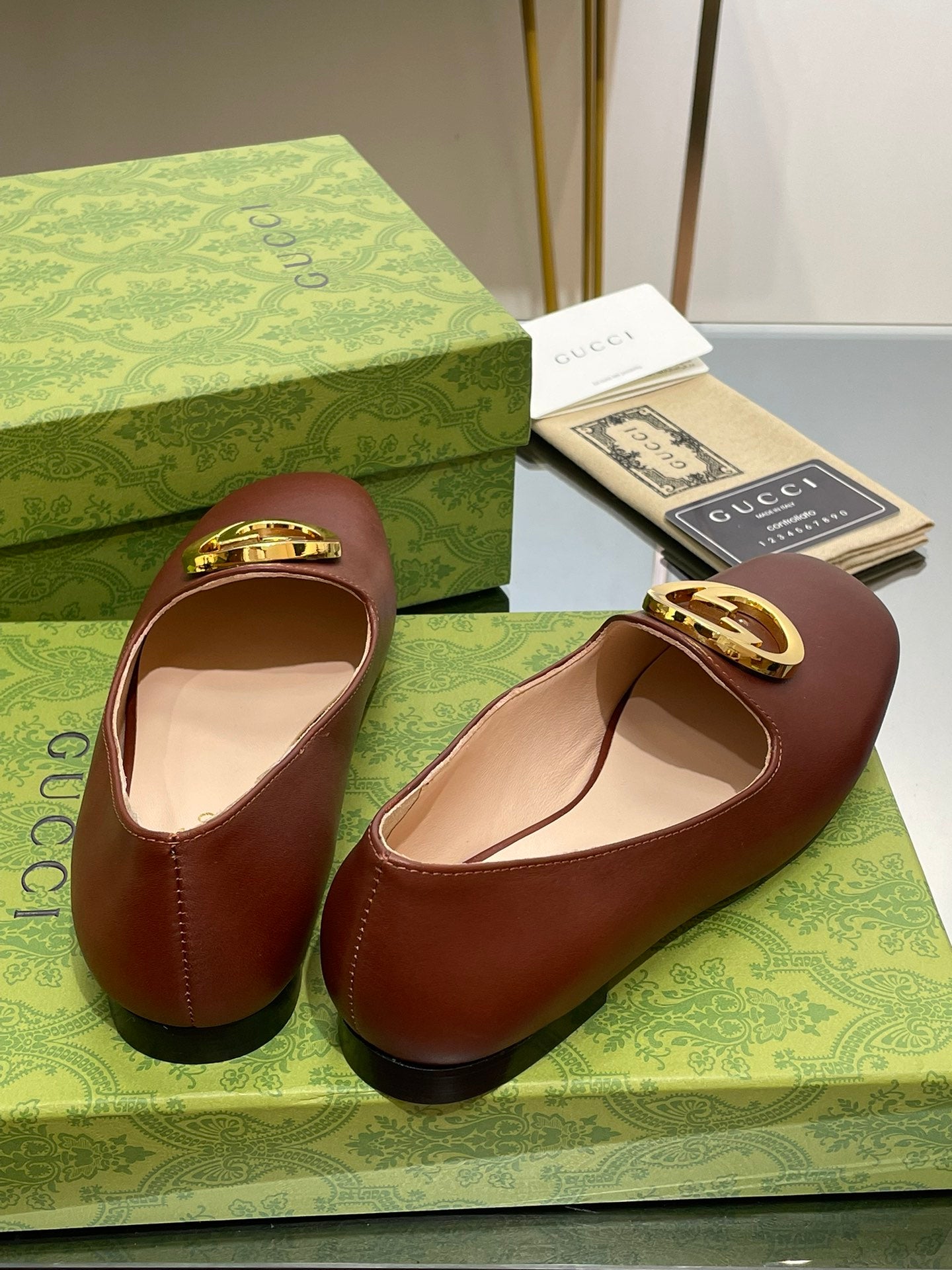 GUCCI BLONDIE LOGO-PLAQUE LOAFERS IN SYRUP BROWN CALFSKIN WITH GOLD HARDWARE