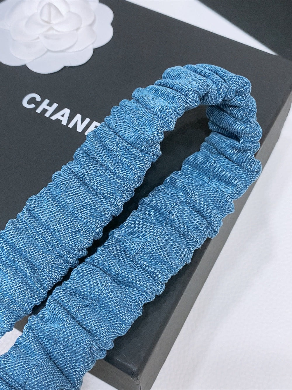 CHANEL DOUBLE C ELASTIC BELT 30MM IN BLUE DENIM WITH GOLD BUCKLE AND SIDE RHINESTONE DETAILING