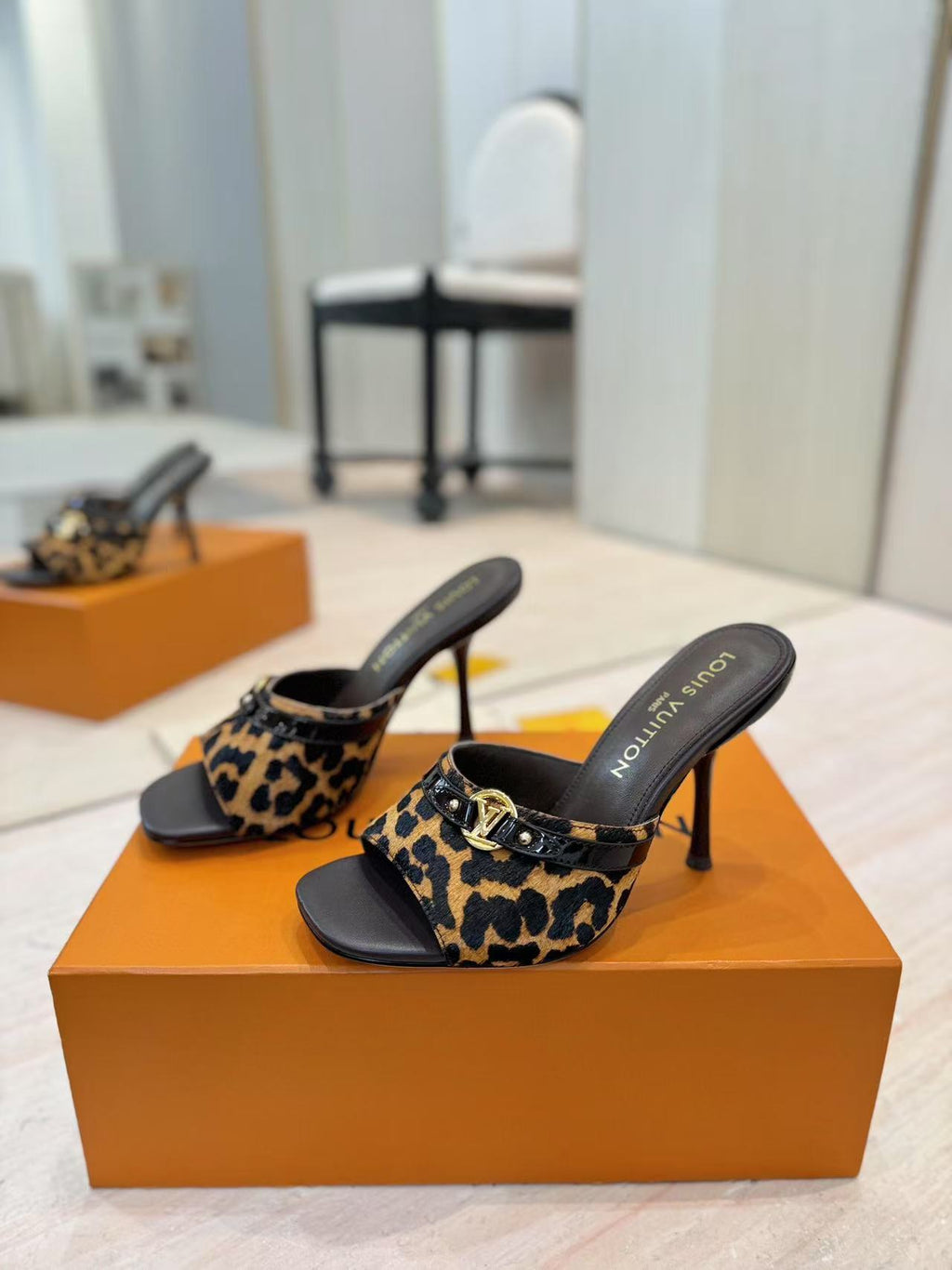 LOUIS VUITTON LV LEOPARD HIGH MULES IN BLACK AND BROWN FUR