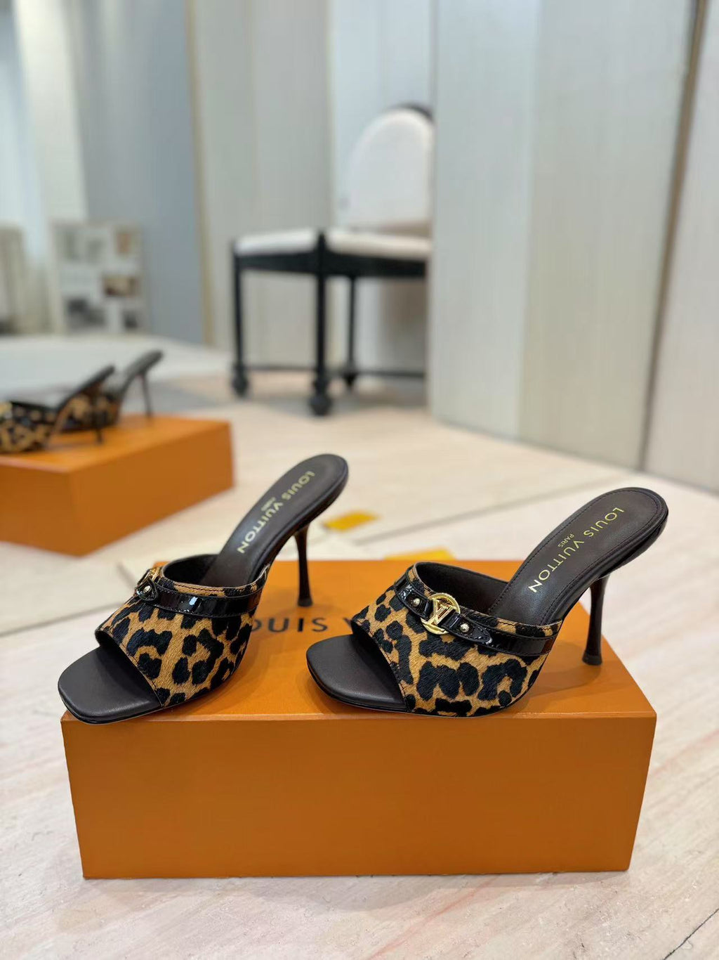 LOUIS VUITTON LV LEOPARD HIGH MULES IN BLACK AND BROWN FUR