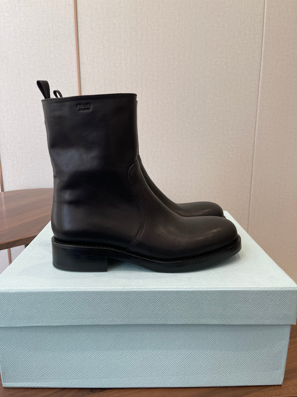 PRADA 25S COWBOY BOOTS IN RK BLACK-BROWN CALFSKIN