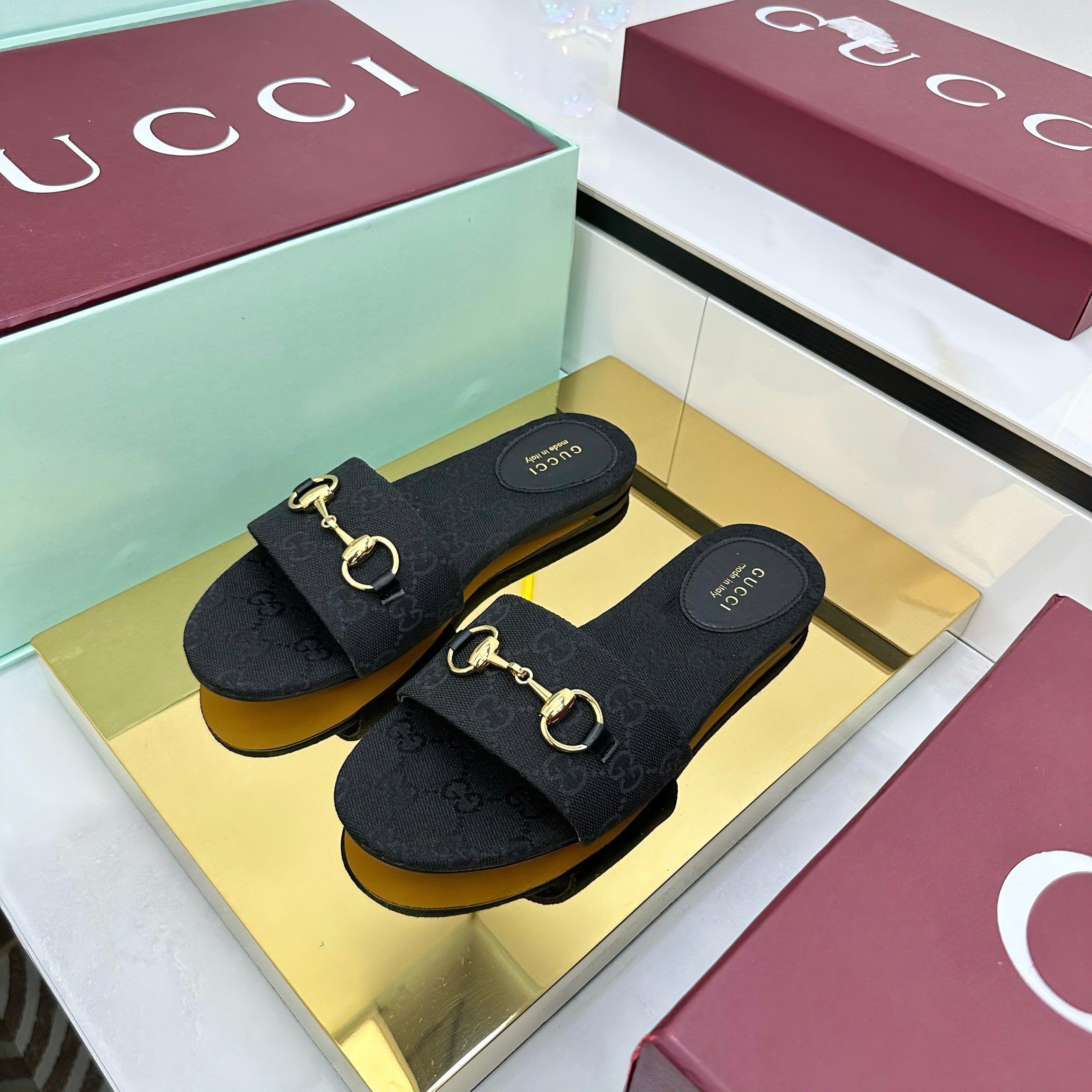 GUCCI SLIDES IN BLACK WITH GOLD HARDWARE