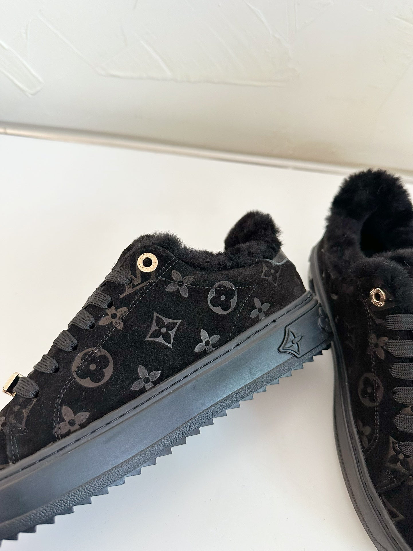 LOUIS VUITTON TIME OUT SNEAKER IN BLACK MONOGRAM EMBOSSED SUEDE WITH FLEECE LINING