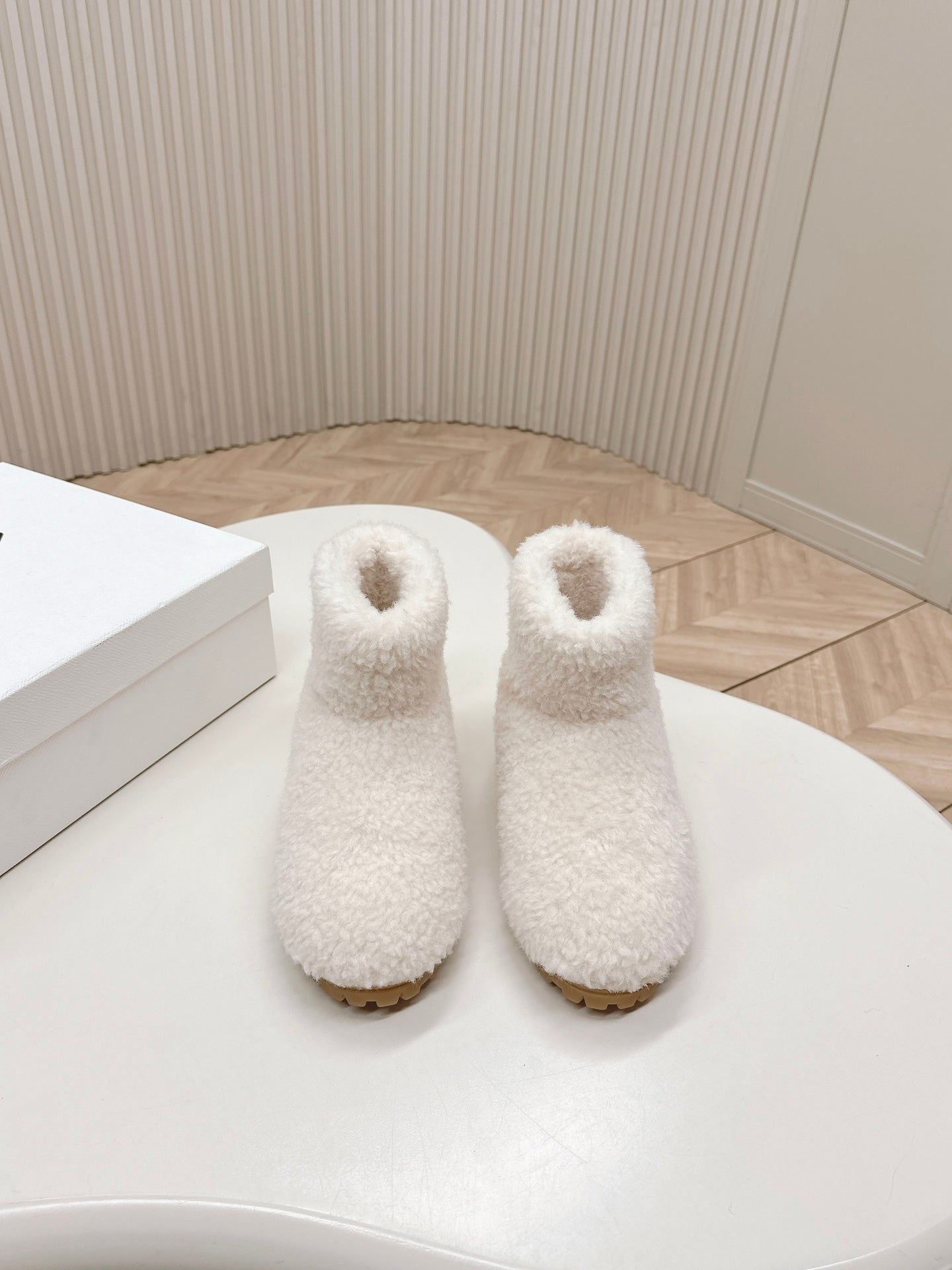 PRADA SNOW ANKLE BOOTS IN WHITE SHEARLING