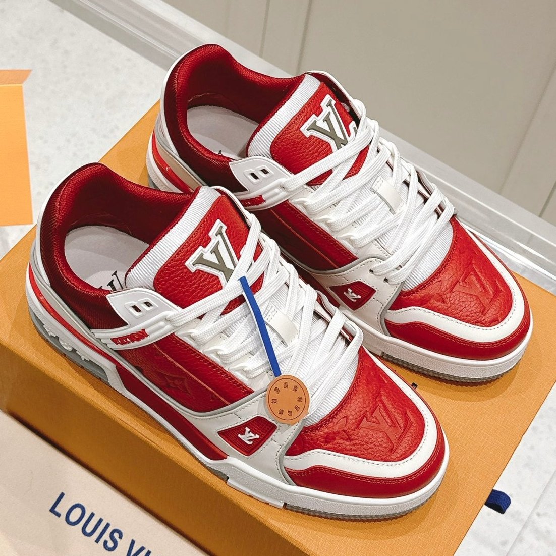 LOUIS VUITTON LV TRAINER SNEAKER IN SARI RED GRAINED CALFSKIN