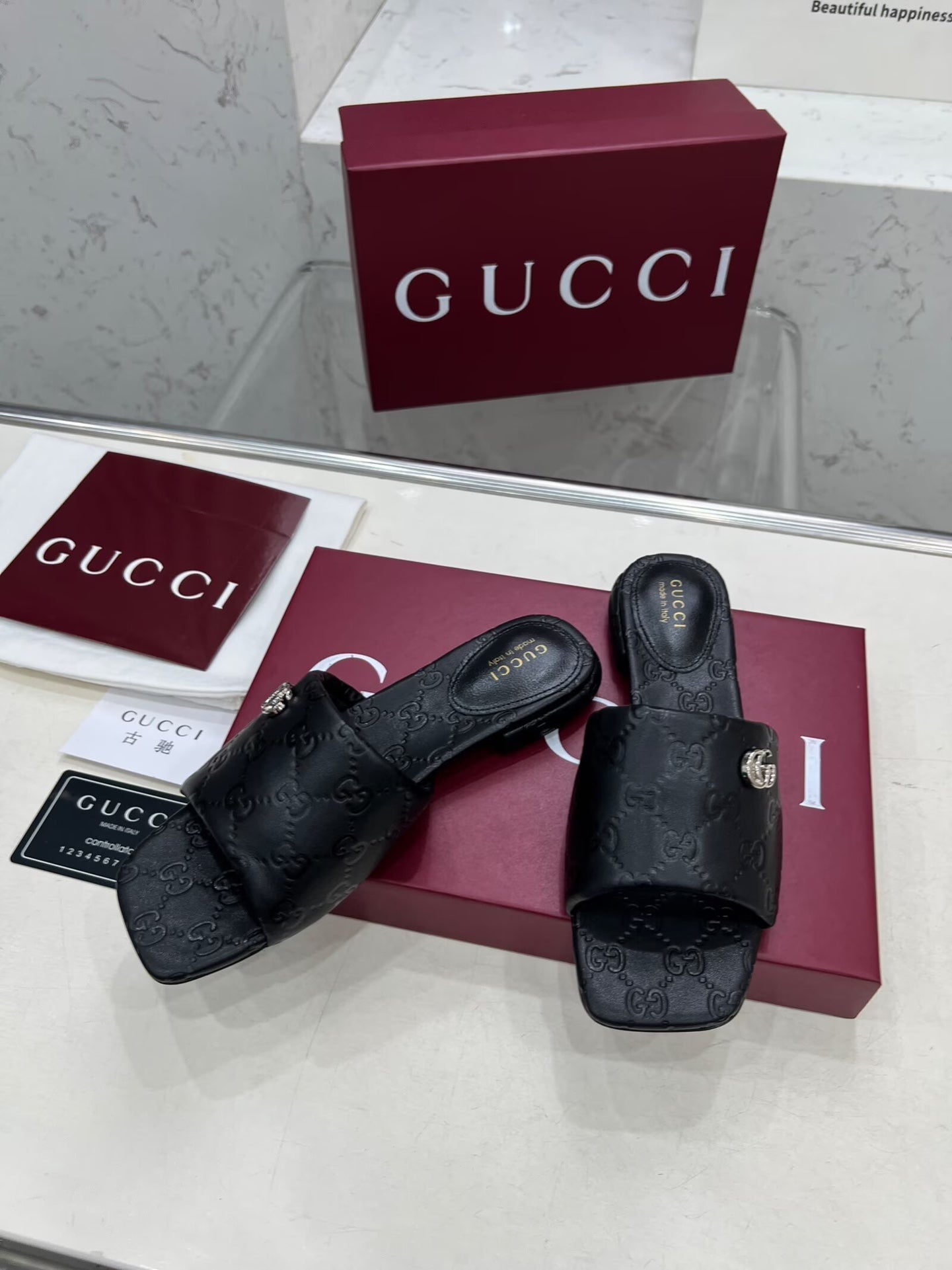GUCCI CASUAL SLIPPERS IN BLACK CALFSKIN LOGO EMBOSSING