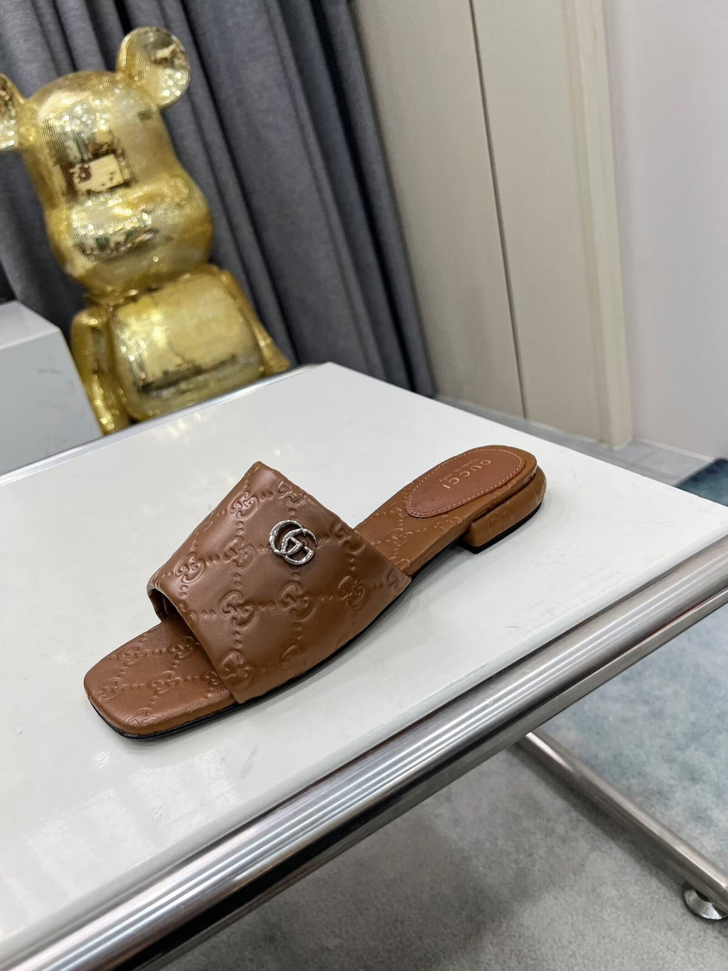 GUCCI CASUAL SLIPPERS IN BROWN CALFSKIN LOGO EMBOSSING