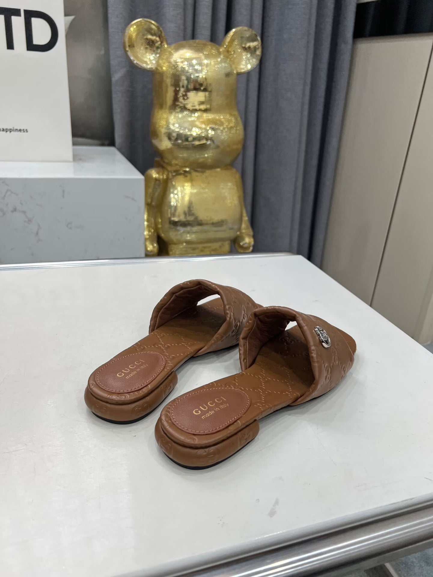 GUCCI CASUAL SLIPPERS IN BROWN CALFSKIN LOGO EMBOSSING