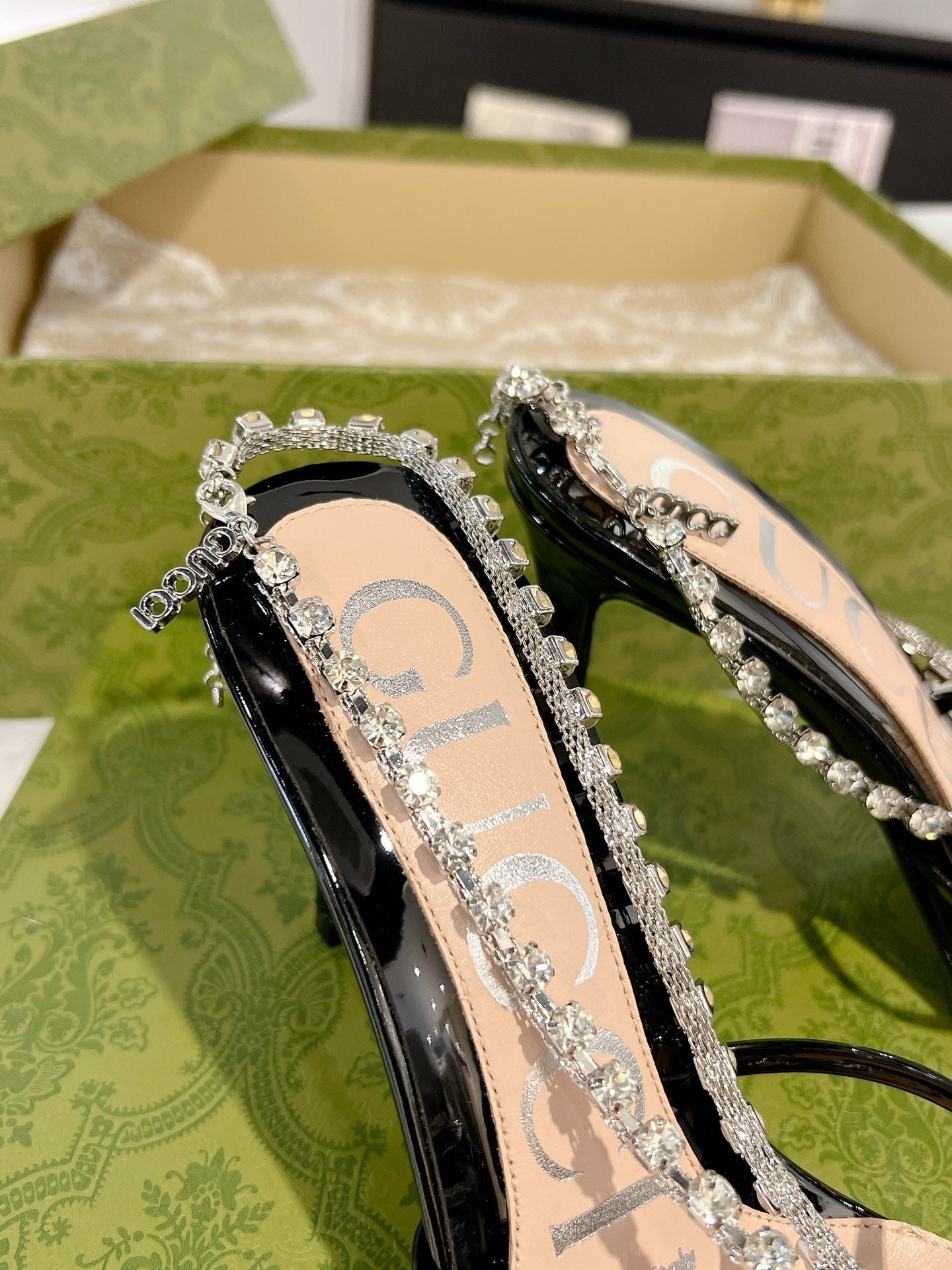 GUCCI STRAPPY SANDAL WITH RHINESTONE CHAIN IN BLACK PATENT LEATHER