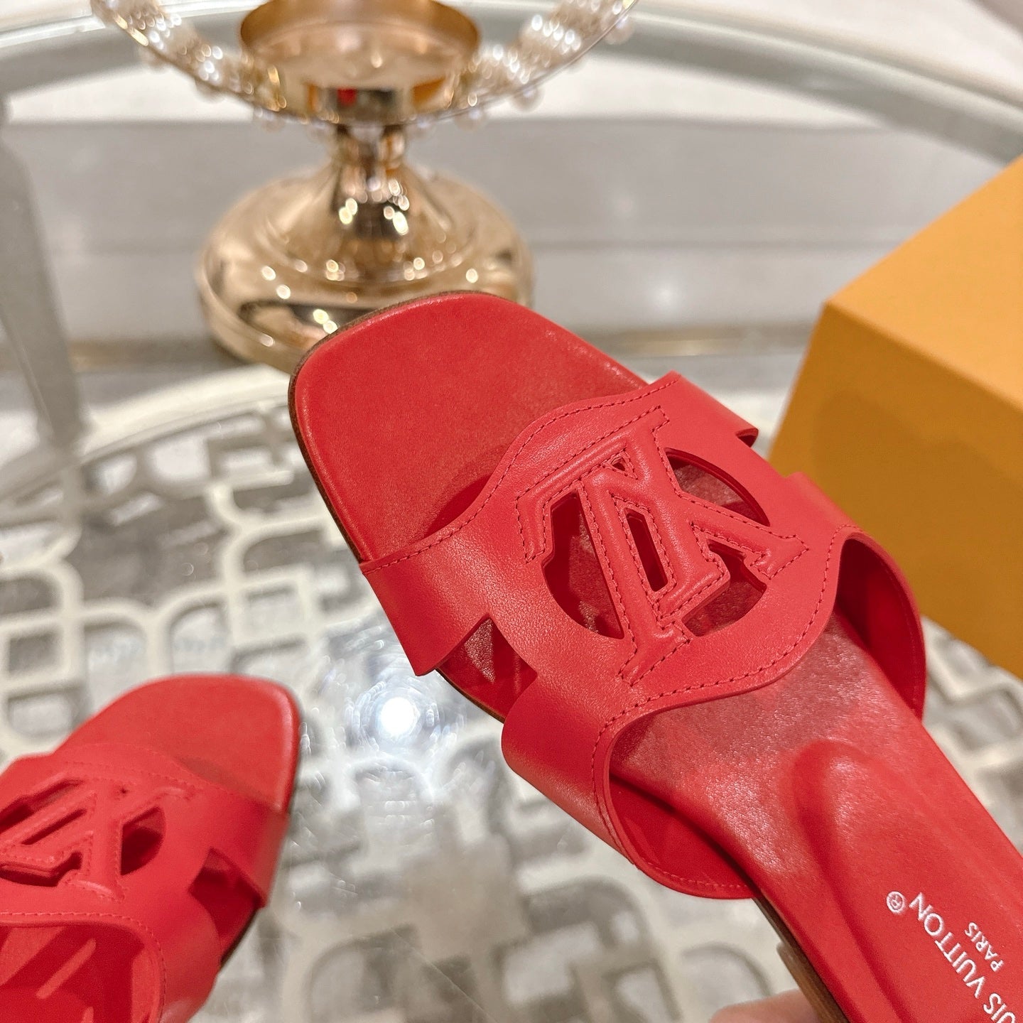 LOUIS VUITTON ISOLA FLAT SLIDE IN CHERRY RED CALFSKIN