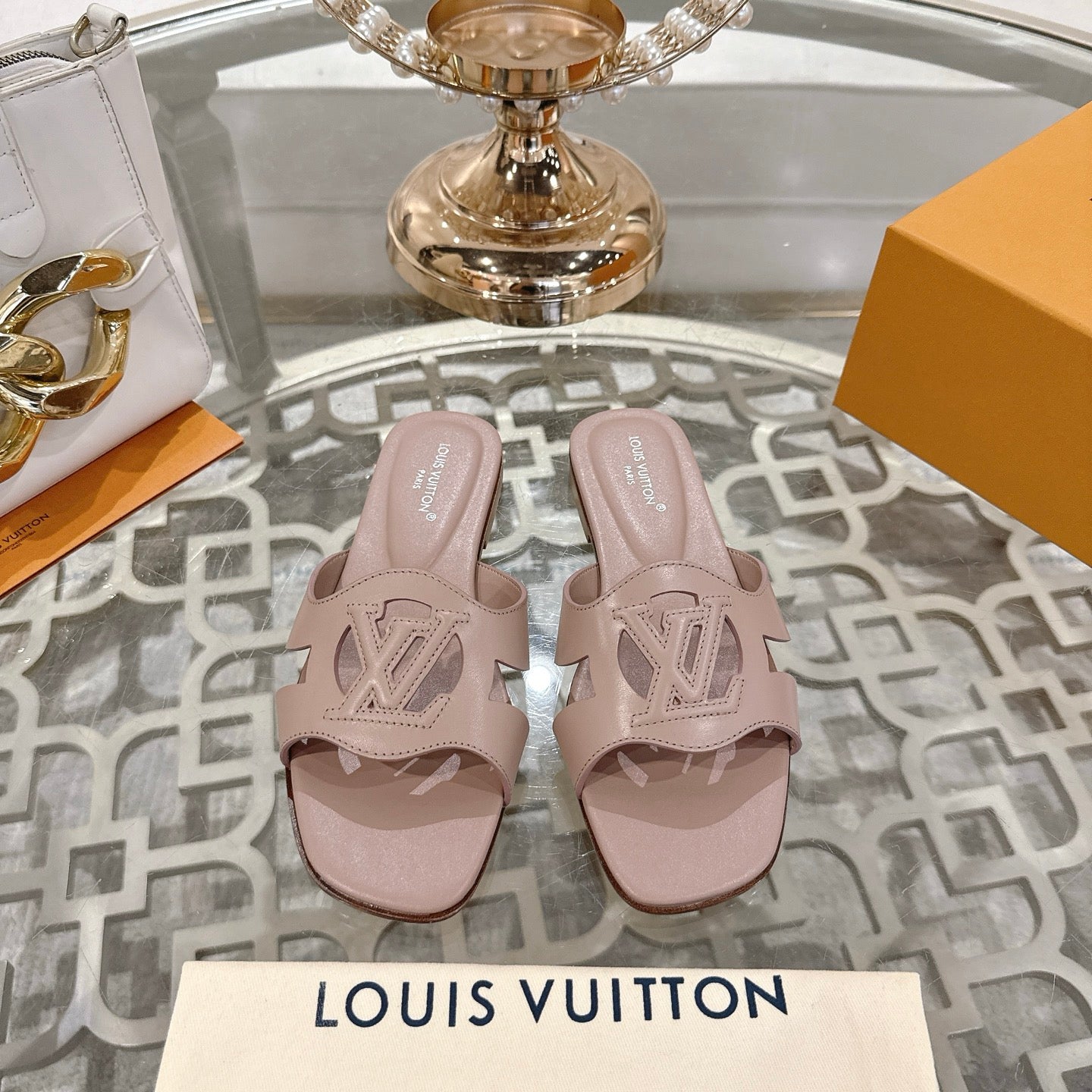 LOUIS VUITTON ISOLA FLAT SLIDE IN DUSTY PINK CALFSKIN