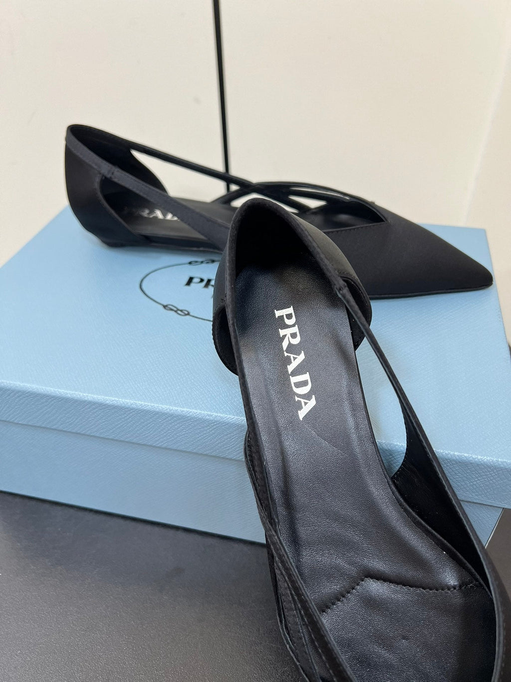 PRADA CUT-OUT BALLERINAS IN BLACK SATIN