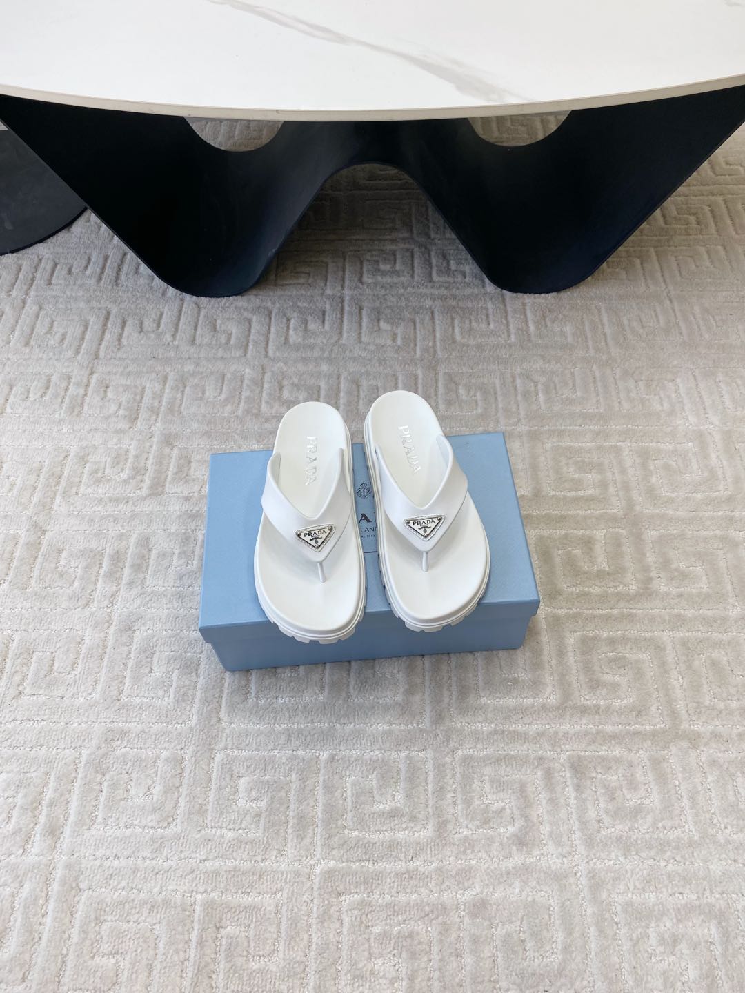 PRADA THICK-SOLED FLIP FLOPS IN WHITE RUBBER