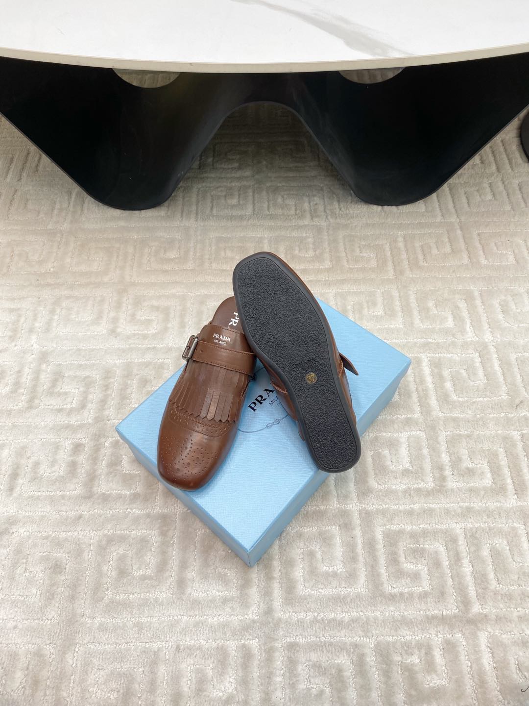 PRADA TASSEL MULES IN RUSSET BROWN LAMBSKIN