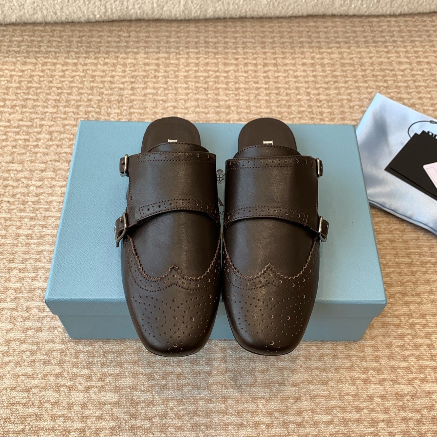 PRADA DOUBLE MONK MULES IN WALNUT BROWN CALFSKIN