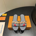 LOUIS VUITTON LV SLIDE SANDALS 25S IN DARK GREY DENIM AND CALFSKIN WITH CHERRY BLOSSOM BUCKLE