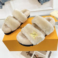 LOUIS VUITTON HALF MULE SLIPPERS IN CAMEL BEIGE FLEECE FEATURING METALLIC LOGO