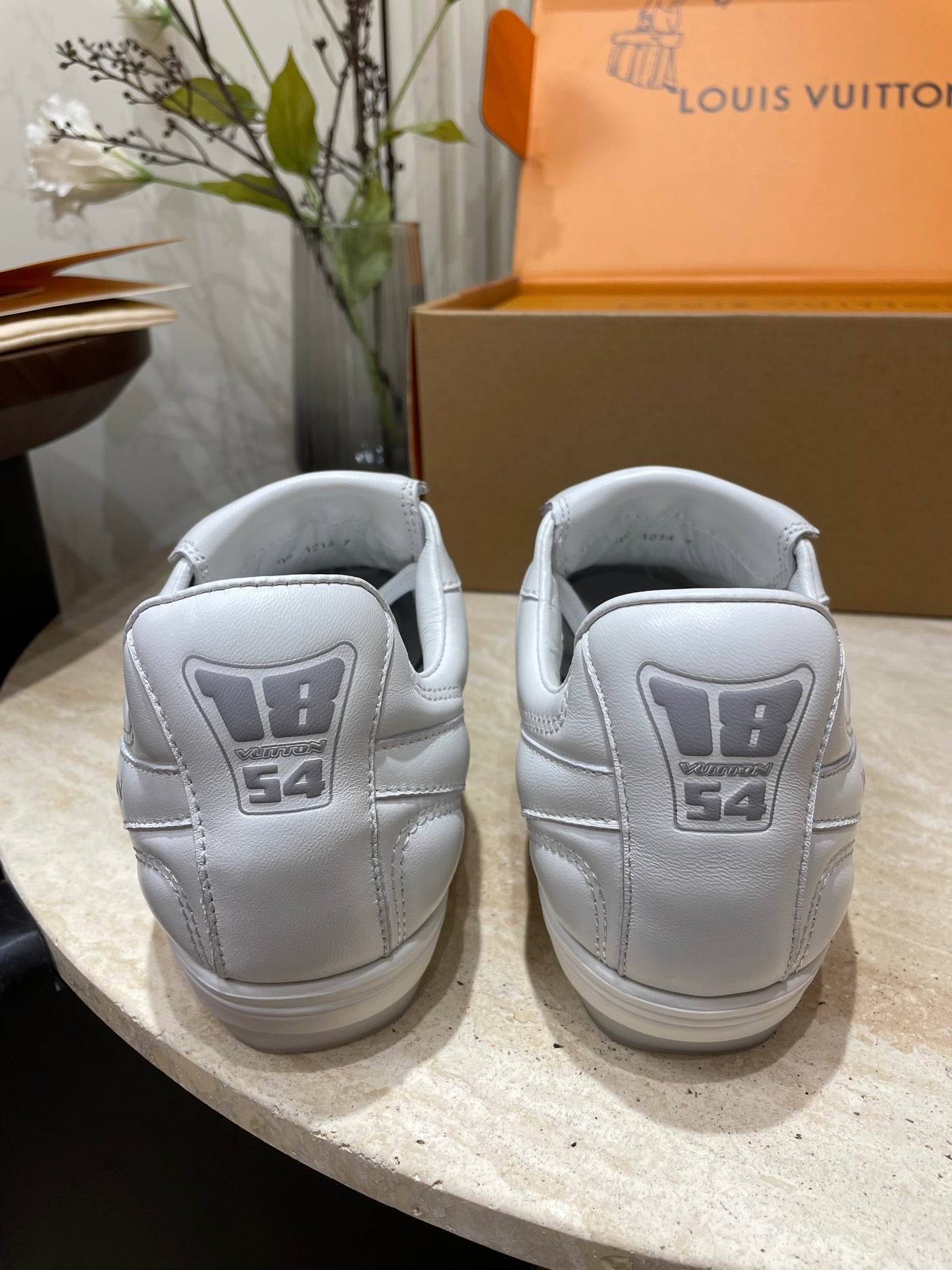LOUIS VUITTON FOOTPRINT SOCCER SNEAKER IN WHITE CALFSKIN