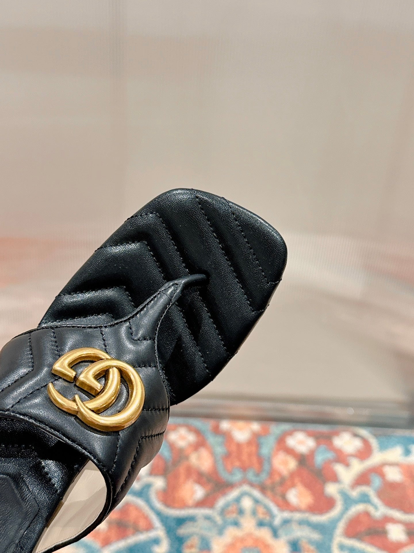 GUCCI HIGH THONG MULE 55MM IN BLACK CALFSKIN WITH GOLD HARDWARE