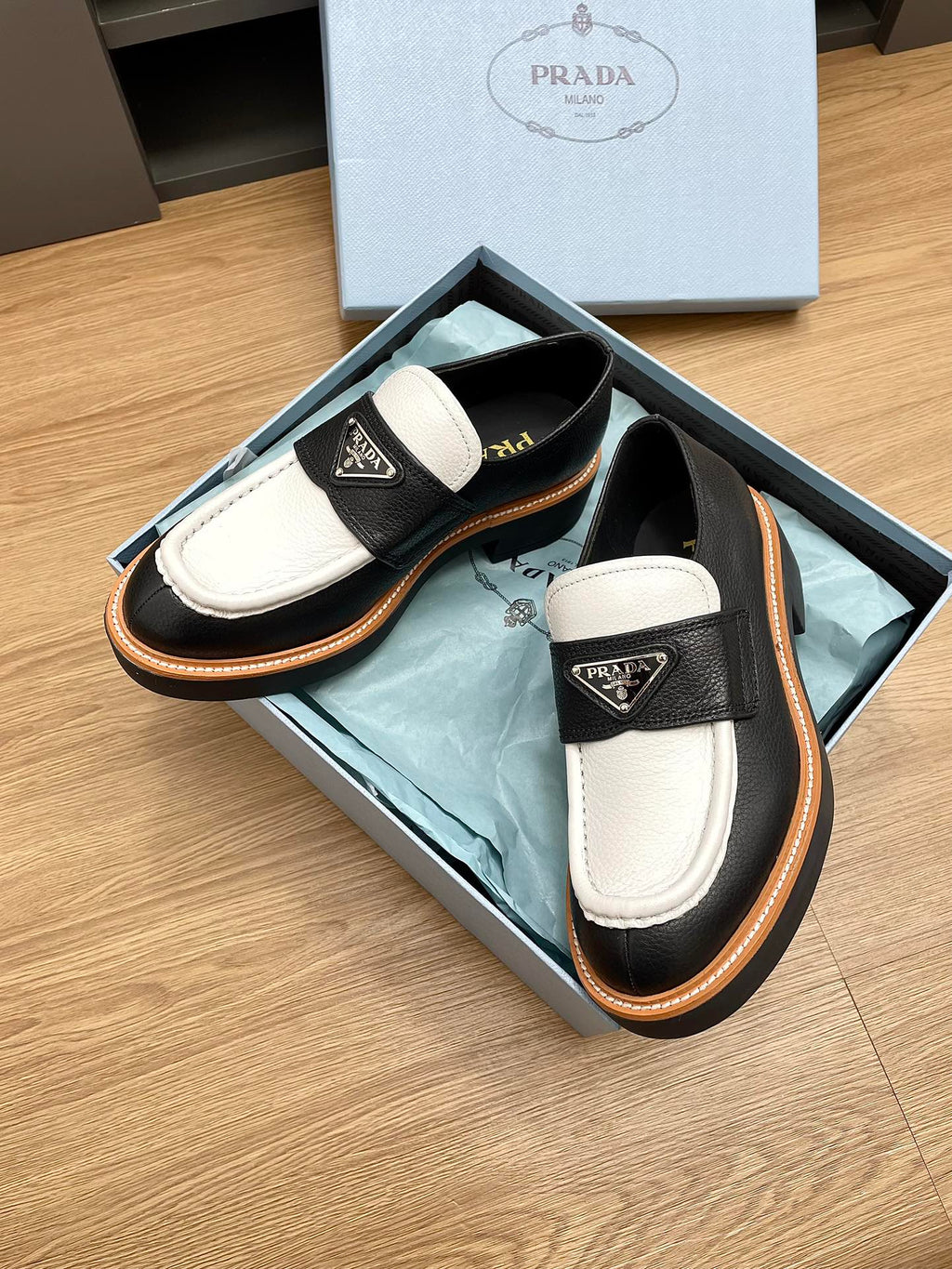 PRADA CHOCOLATE LOAFERS BLACK AND WHITE CALFSKIN