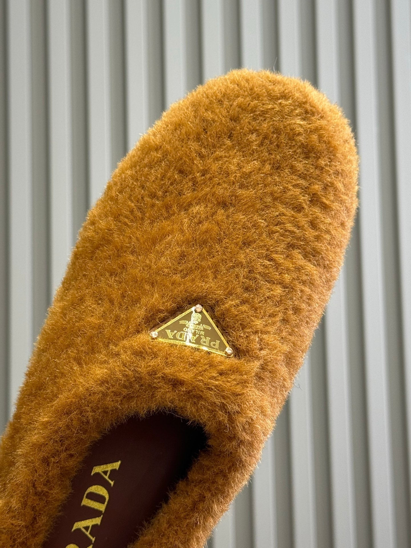 PRADA 25S CLOGS IN RK ORANGE SHEARLING