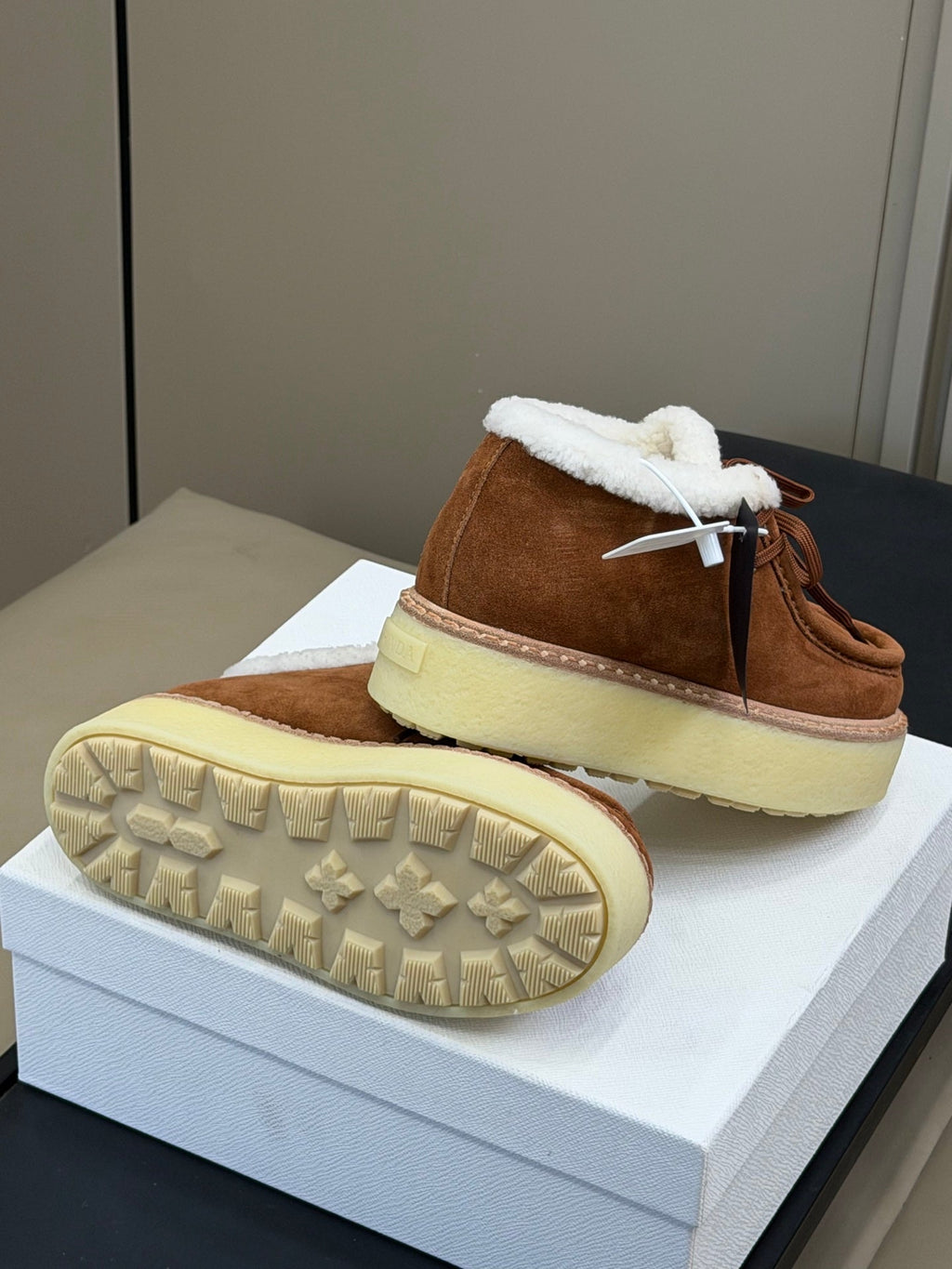 PRADA 25S HIGH-TOP SHOES 40 MM IN RK BROWN SUEDE SHEARLING-LINED