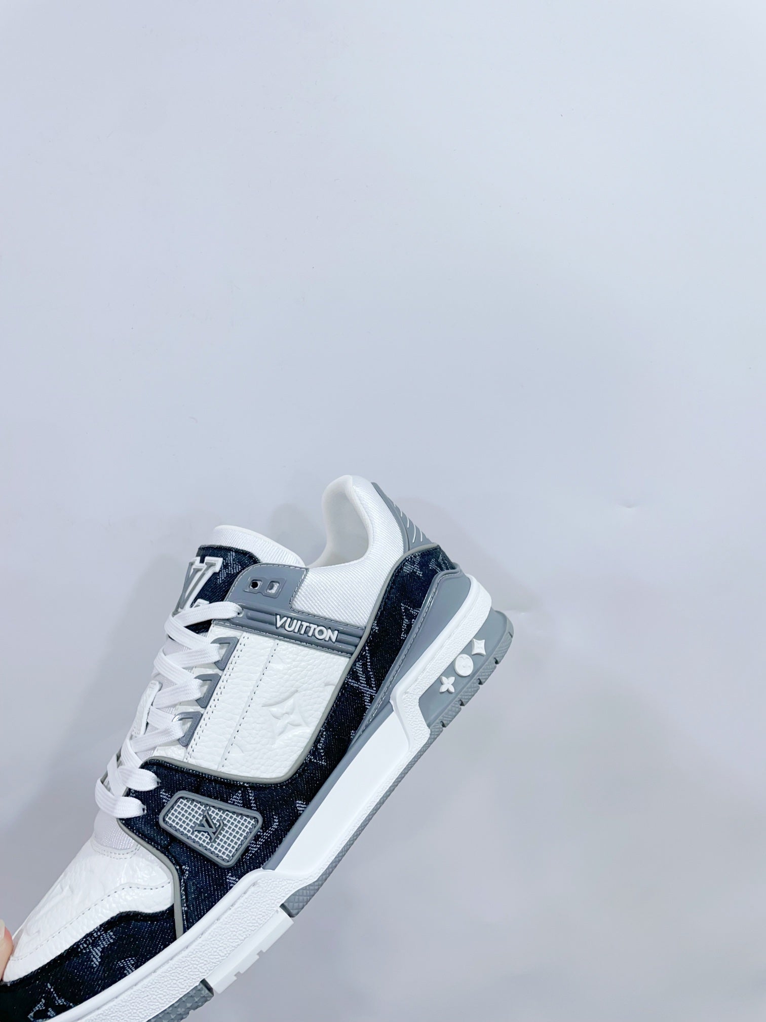 LOUIS VUITTON LV TRAINER SNEAKER IN WHITE CALFSKIN AND BLACK MONOGRAM DENIM