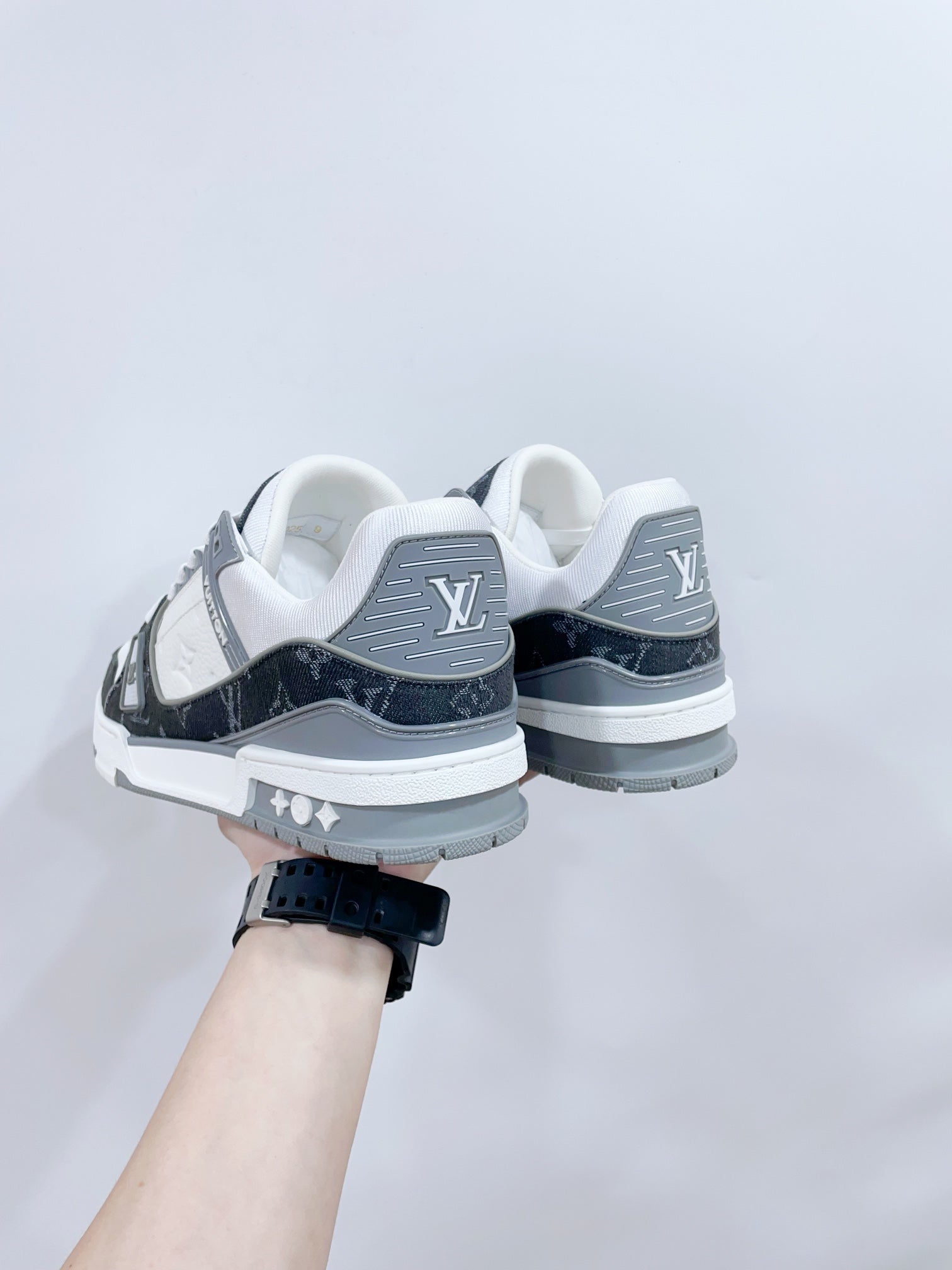 LOUIS VUITTON LV TRAINER SNEAKER IN WHITE CALFSKIN AND BLACK MONOGRAM DENIM