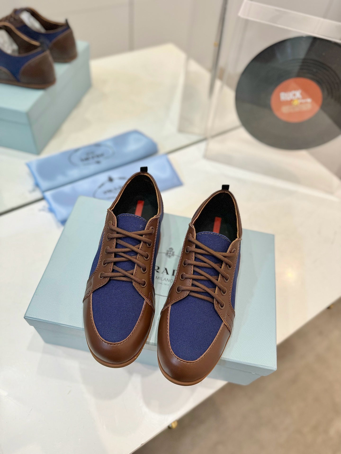 PRADA SNEAKERS IN BROWN LAMBSKIN AND NAVY BLUE CANVAS