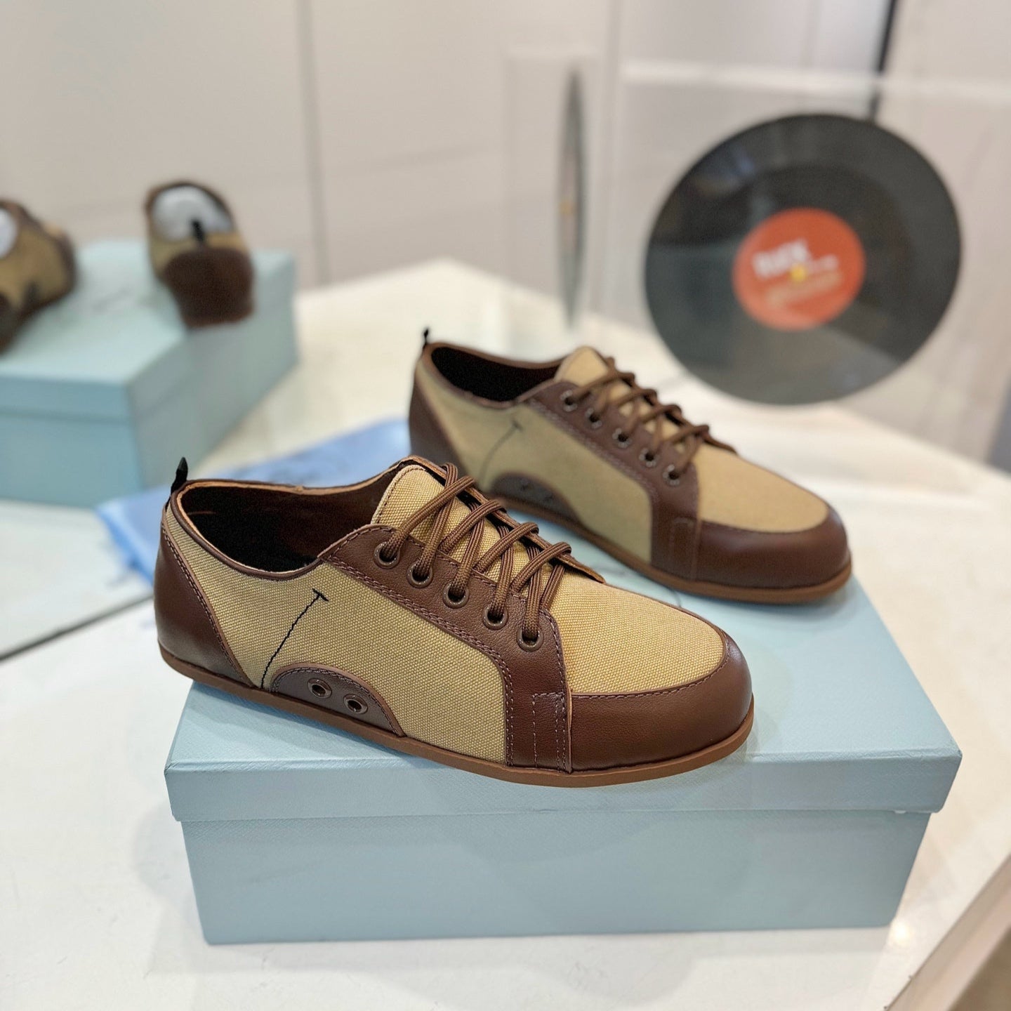 PRADA SNEAKERS IN BROWN LAMBSKIN AND BEIGE CANVAS