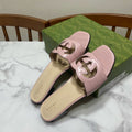 GUCCI SLIDES IN PASTEL PINK CALFSKIN LOGO-EMBOSSED STRAP